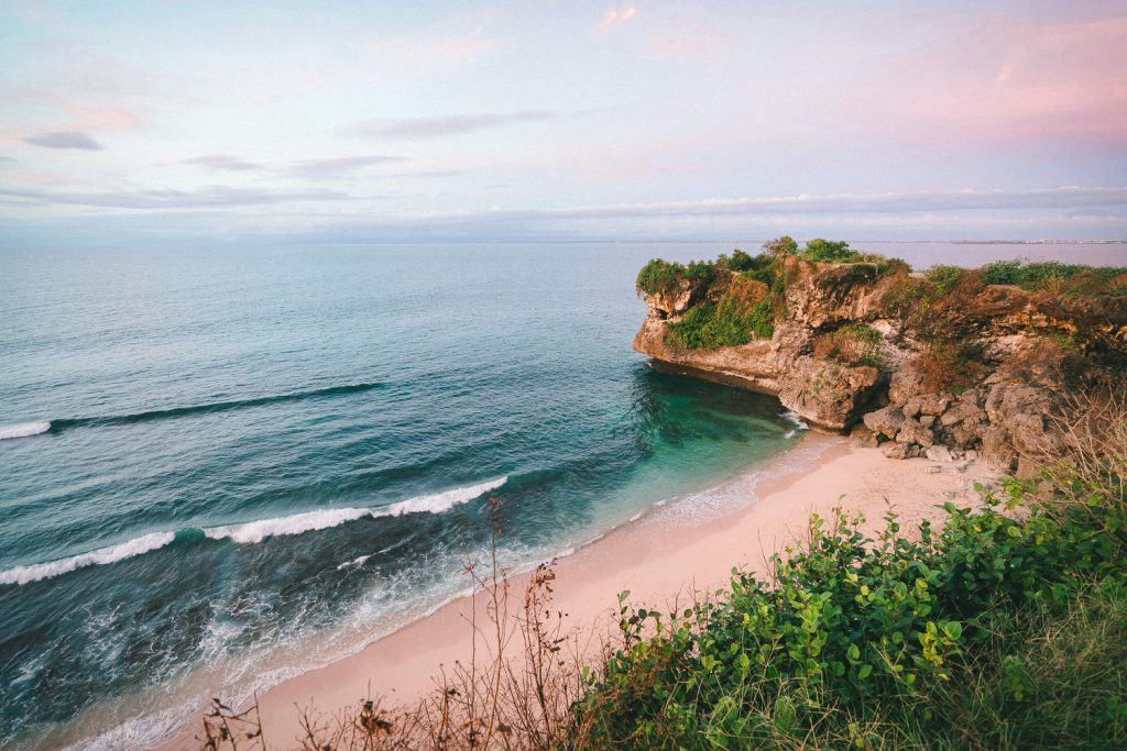 Waves crashing the shore on Balangan Beach in Uluwatu, Bali